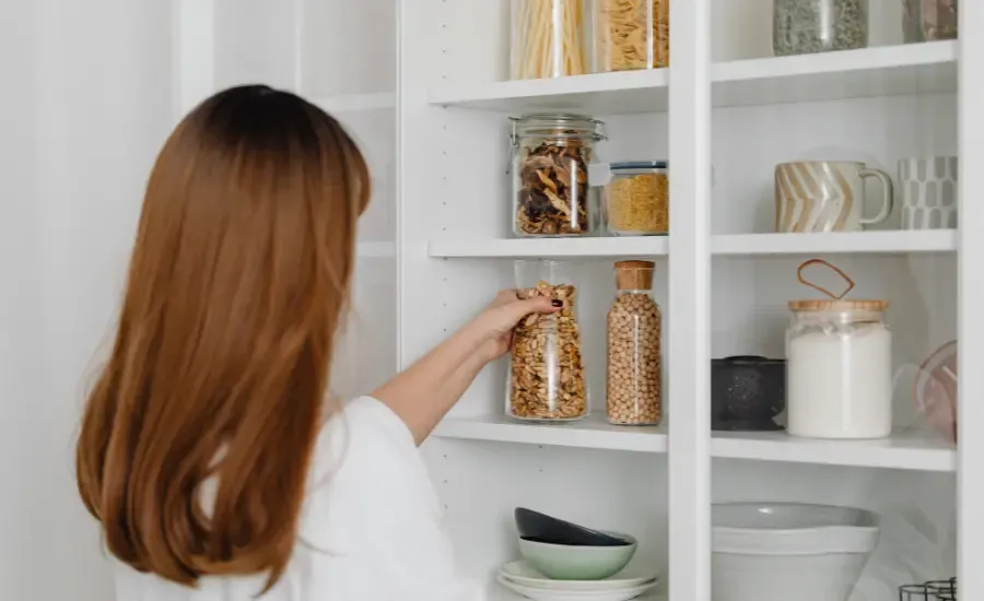 woman getting rid of things in her house to declutter