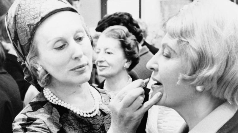 estee lauder putting make up on a client
