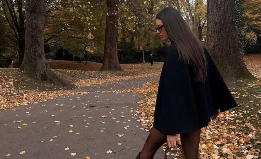 woman walking in the fall in a neighborhood
