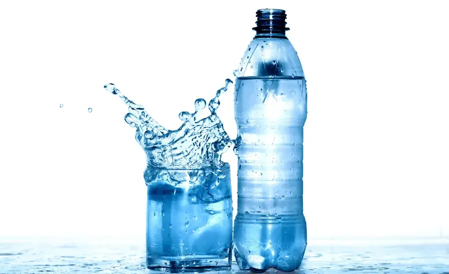 a glass of water and a bottle of water