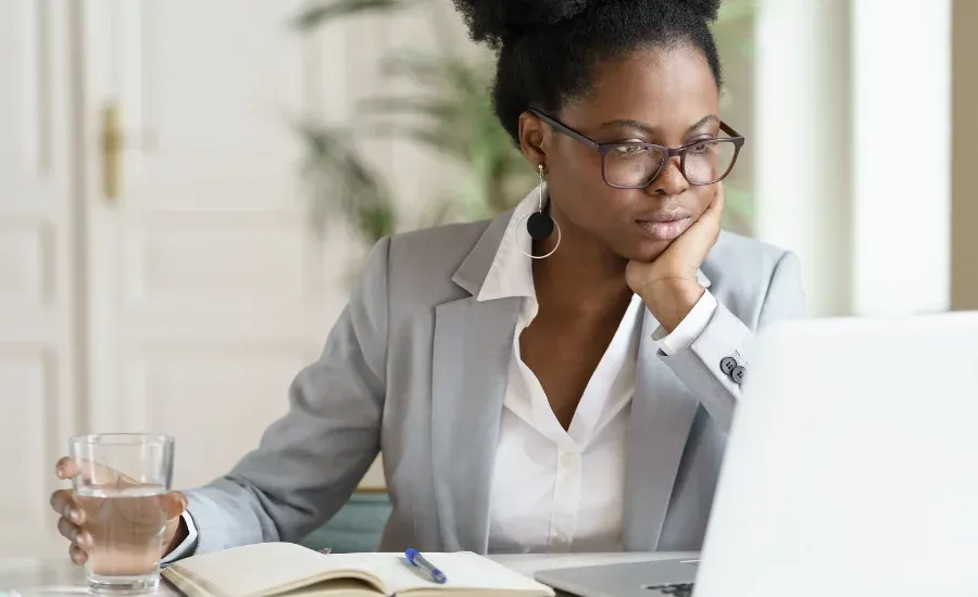 woman checking her insurance benefits in laptop
