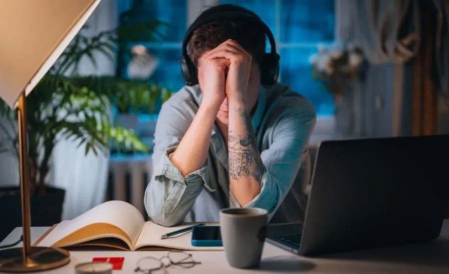 women sitting in her office stressed