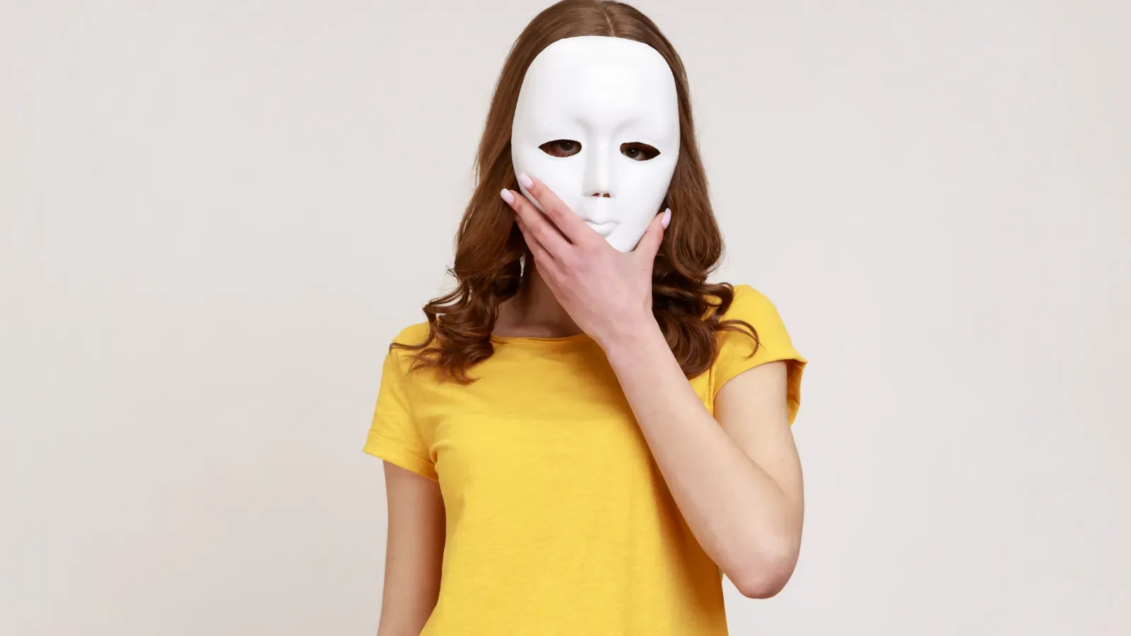 Woman in yellow tshirt wearing a mask
