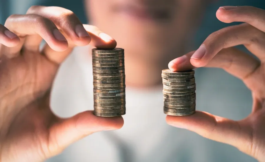 woman holding less money because of the gender pay gap