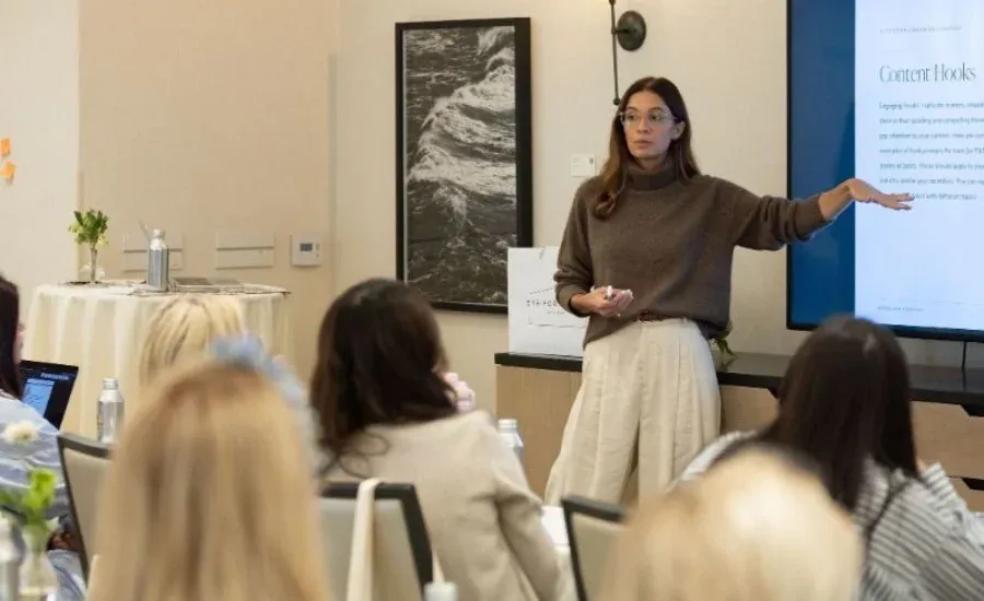 woman presenting in a full woman room